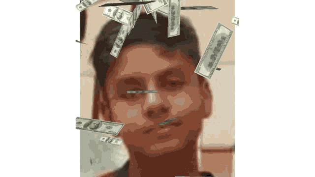 a man 's face is surrounded by hundred dollar bills falling from the sky