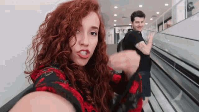 a man and a woman are taking a selfie together