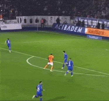 a soccer game is being played in front of a banner that says " vakifbank "