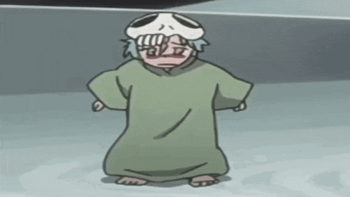 a cartoon character with a skull on his head and a green robe .