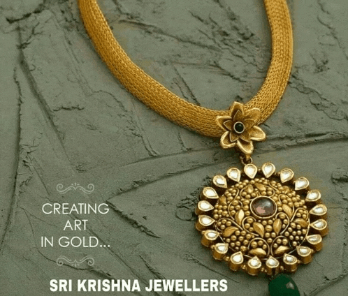 a gold necklace with a pendant that says sri krishna jewellers on the bottom