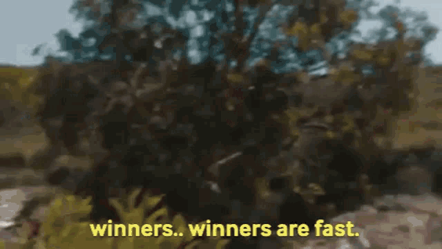a blurry picture with the words winners winners are fast in yellow letters