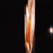 a blurry picture of a person 's face with orange and white spots on it