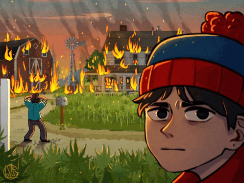 a man in a red hat stands in front of a house on fire