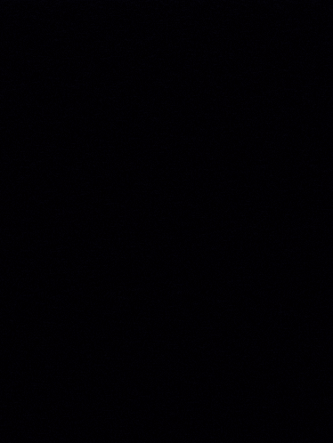 a dark background with purple and blue lights coming out of it