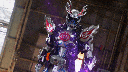 a masked rider with a purple helmet and a red eye is standing in a building