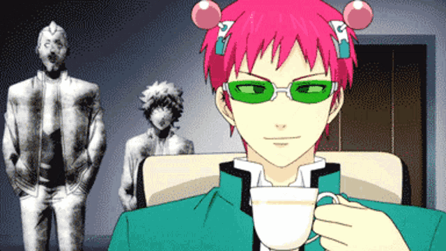 a man with pink hair is holding a cup of coffee