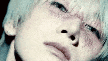 a close up of a person 's face with a lot of glitter on it .