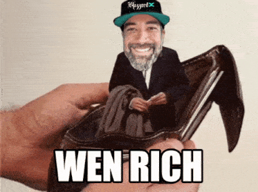 a person holding a wallet with a picture of a man in it and the words wen rich on it