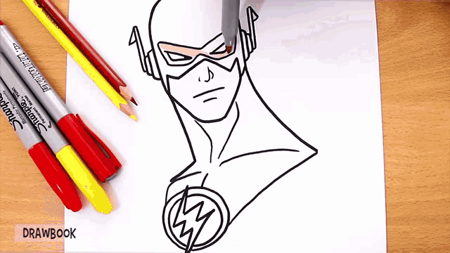 a drawing of a flash is on a piece of paper with drawbook written on it