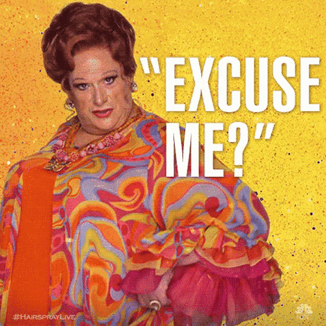 a woman in a colorful dress says " excuse me ? "