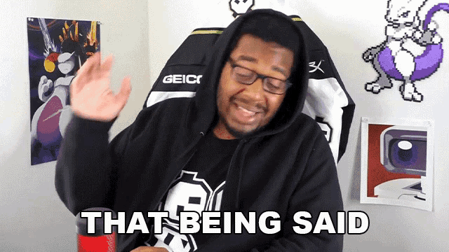 a man wearing a hoodie and glasses is saying that being said