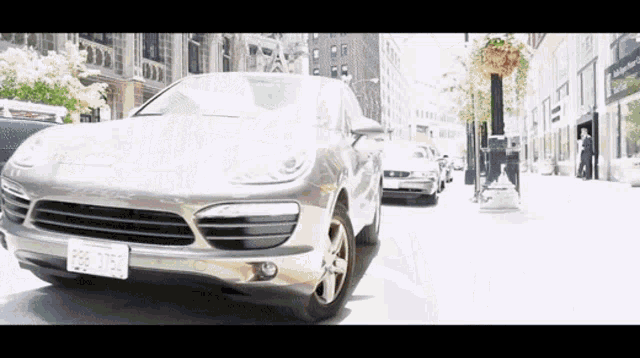 a silver car with a license plate that says 926 atb