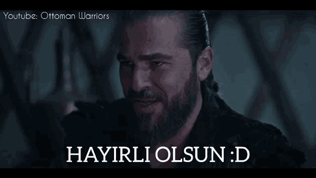 a man with a beard and the words hayirli olsun : d on the bottom