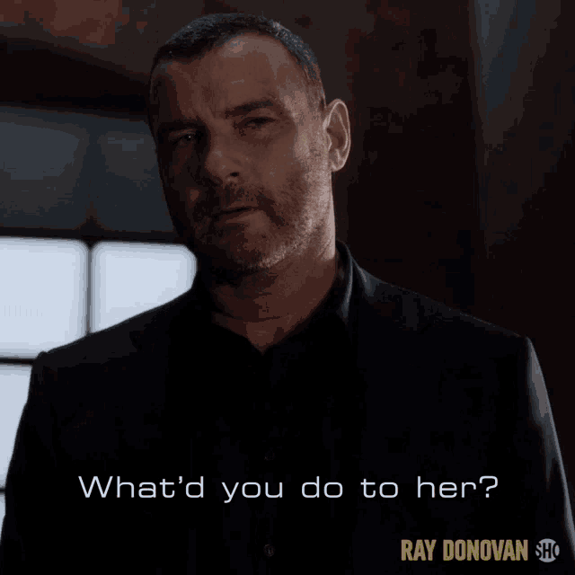 a man in a black suit is asking what 'd you do to her