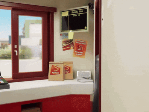a sign that says ready now hangs above a counter