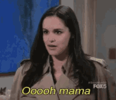a woman in a trench coat says oooh mama