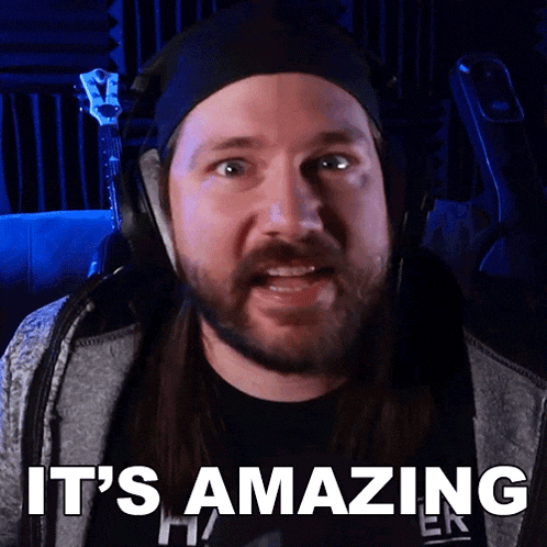 a man wearing headphones and a headband says it 's amazing