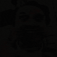 a man wearing headphones is making a funny face