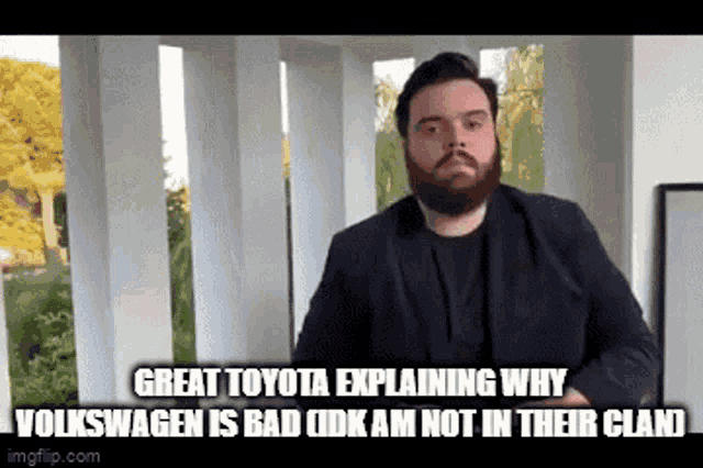 a man with a beard is explaining why volkswagen is bad and not in their clan
