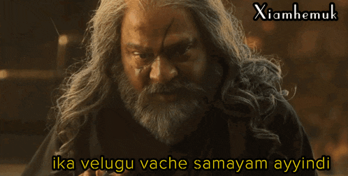 a man with long hair and a beard says ika velugu vache samayam ayindi