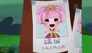 a picture of a doll with pink hair and a tiara is taped to a tree trunk .
