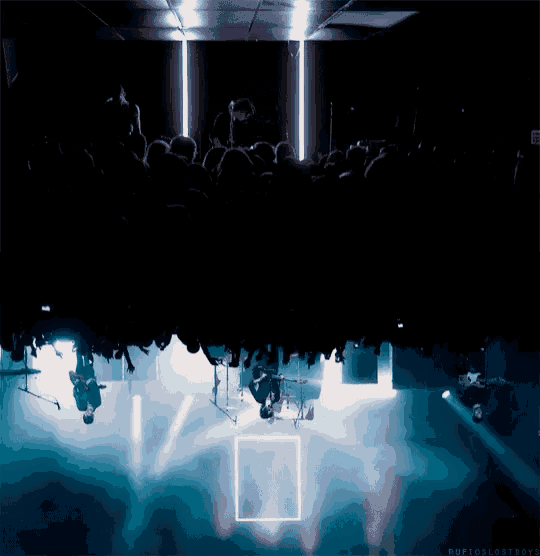 a group of people are sitting in a dark room with the words ruffoslostboys written on the bottom