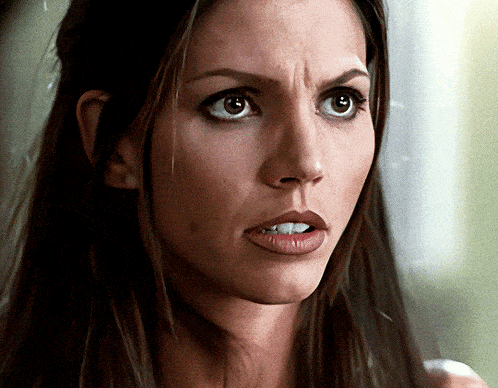 a close up of a woman 's face with long hair