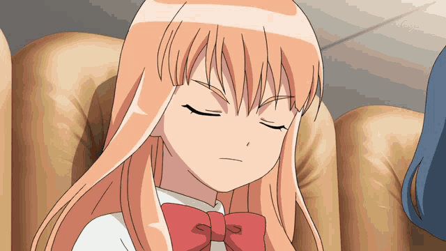 a girl with long hair and a red bow is sitting on a couch with her eyes closed