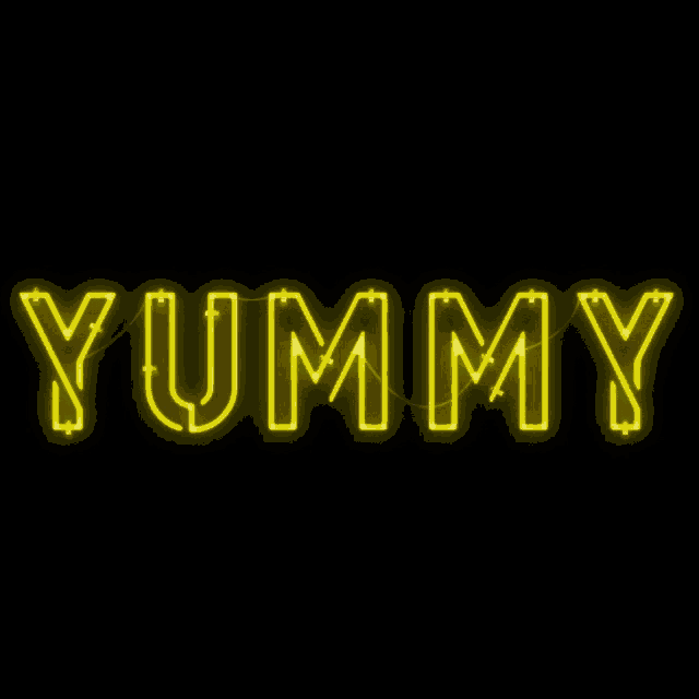 a neon sign that says yummy in yellow letters