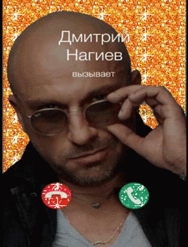 a man wearing sunglasses is talking on a phone with the name dmitrii nagiev