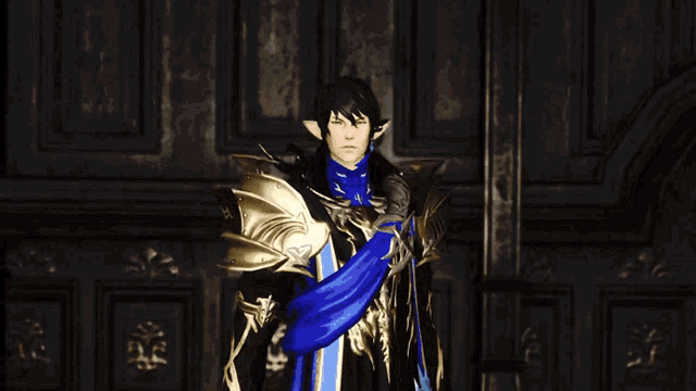 a video game character with a blue shirt and gold armor giving the middle finger
