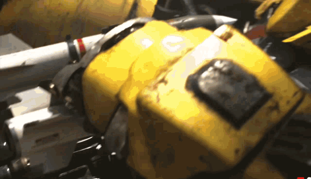 a close up of a yellow object with a red arrow pointing to the right
