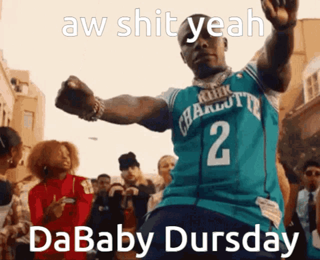 a man in a charlotte jersey is dancing in front of a crowd with the caption aw shit yeah dababy dursday