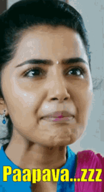 a close up of a woman 's face with the words `` paapava ... zzz '' written above her .