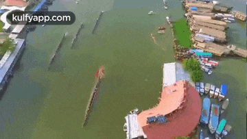 an aerial view of a painting of a man flying over a river .