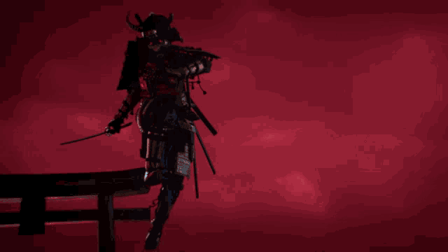 a samurai with horns is holding a sword in front of a red sky
