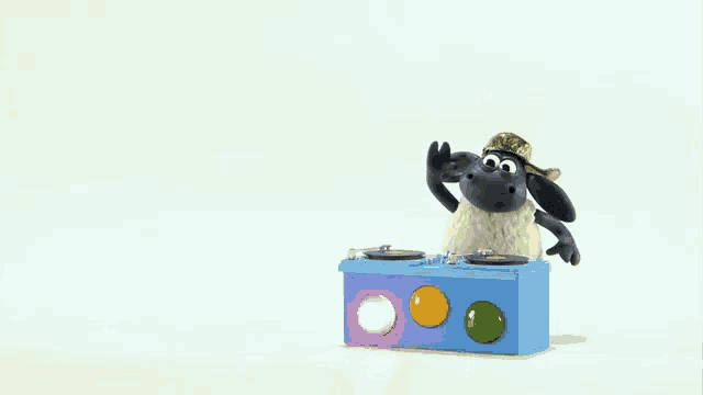 a cartoon sheep is doing a handstand on top of a blue box