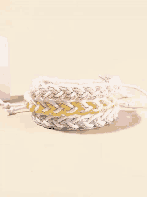 a close up of a bracelet on a table .