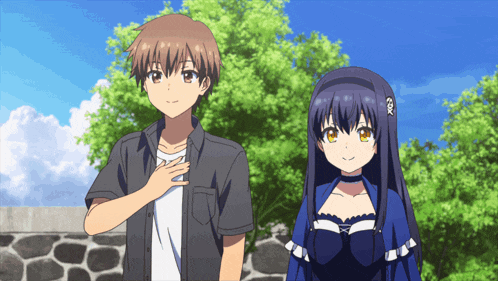 a boy and a girl are standing next to each other in a park