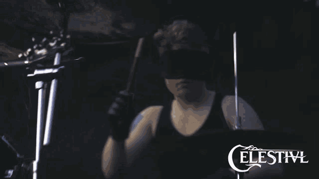 a celestivl poster with a blindfolded drummer