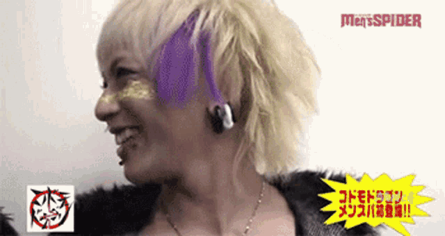 a man with purple hair is smiling in front of a men spider sign