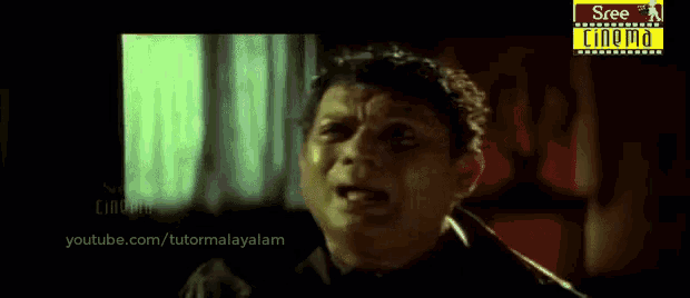 a man 's face is shown in a video from youtube.com/tutomalayalam