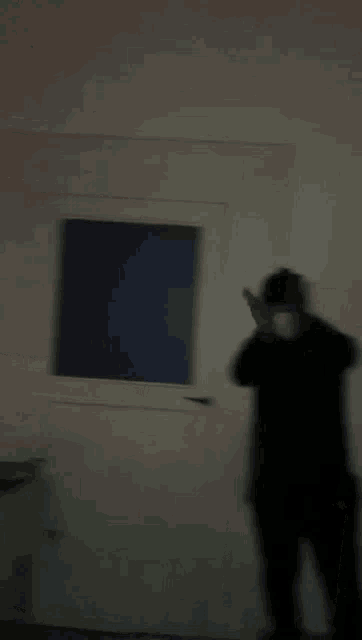a man is taking a picture of himself in front of a mirror .
