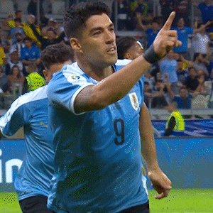 a soccer player wearing a blue jersey with the number 9 on the front
