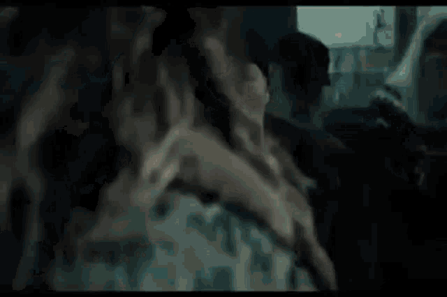 a group of people are sitting in a car with smoke coming out of the window .