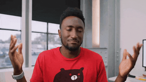 a man wearing a red t-shirt with a bear on it