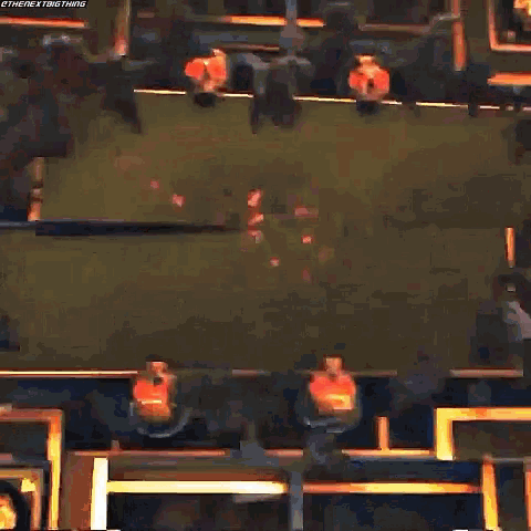 a blurry picture of a person 's face with a red circle in the background .