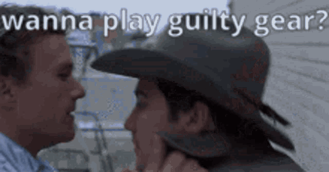 a man in a cowboy hat is talking to another man .