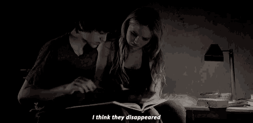 a boy and a girl are reading a book together and the girl is saying " i think they disappeared "